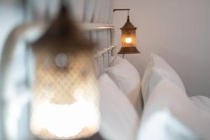 Katil atau katil-katil dalam bilik di Baan Old Town Boutique Stay, Phuket Town