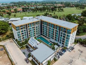 an overhead view of a building with a pool at C227 Brand New Condo Near Top Phuket Beach Clubs in Laguna Phuket