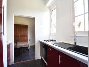 a kitchen with a sink and a stove at Elegant Mansion Stay in Belvès in Belvès