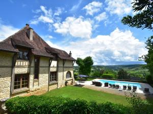 an external view of a house with a swimming pool at Elegant Mansion Stay in Belvès in Belvès