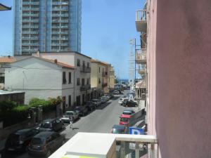 a view of a street with cars parked on the road at Parri Apartment in Follonica