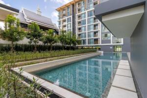 Πισίνα στο ή κοντά στο C228 Brand New Condo Near Beach & Prime Location