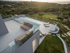 an aerial view of a house with a glass roof at White Grace - A Seductive World of Luxury in Pigi