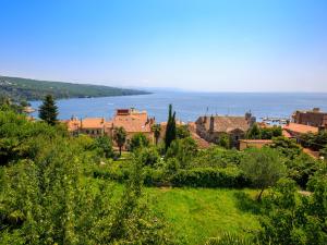 a view of a town with the ocean in the background at Apartment Nika in Opatija