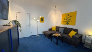 Χώρος καθιστικού στο Charming Apartment in historische Polizeiwache