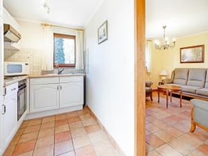 a kitchen and living room with a couch and a table at Holiday home in Porcheresse Daverdisse in Porcheresse