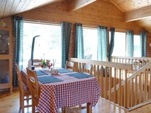 a dining room with a table in a cabin at 6 person holiday home in STRÖMSTAD-By Traum in Strömstad +14 photos