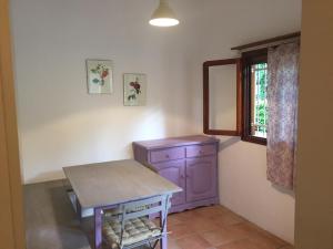a room with a purple cabinet and a window at Villaggio Arco in Eraclea Mare +51 photos