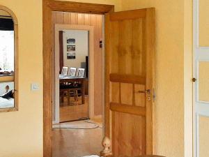 a room with a door and a room with a desk at 8 person holiday home in Lima in Lima +21 photos