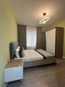 Ένα ή περισσότερα κρεβάτια σε δωμάτιο στο Green City Resort +2 φωτογραφίες