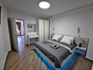 a bedroom with a large bed in a room at New Villa Penelopa in Babino Polje