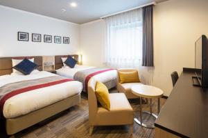 Postel nebo postele na pokoji v ubytování HOTEL MYSTAYS Tachikawa