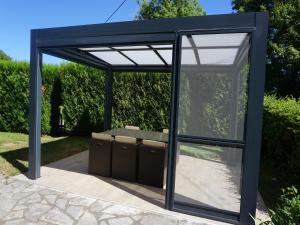 a black pavilion with boxes under it at Holiday Home in Muret near Château Colombier in Muret-le-Château