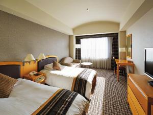 Postel nebo postele na pokoji v ubytování Royal Pines Hotel Urawa + 37 fotografií