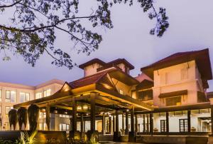 an exterior view of a building at night at Rhythm Lonavala - An All Suite Resort in Lonavala