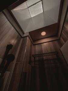 a skylight in a room with a wooden floor at Here Hotel 宅這兒私宅-台南B宅 in Tainan +43 photos