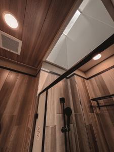 a room with wooden walls and a glass ceiling at Here Hotel 宅這兒私宅-台南B宅 in Tainan