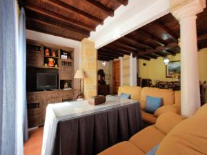 a living room with a couch and a tv at Holiday Home in Zagrilla Alta with Pool in Zagrilla +22 photos