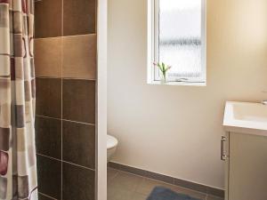a bathroom with a toilet and a window at 5 star holiday home in Kappeln in Kappeln