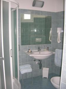 a bathroom with a sink and a shower at Hotel Tibidabo in Bellaria-Igea Marina +63 photos
