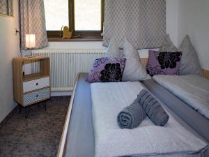 a bedroom with two twin beds with pillows at Apartment in Hollersbach near Ski Slopes in Bramberg am Wildkogel