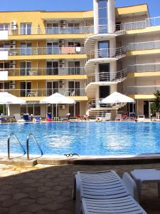 a large swimming pool in front of a hotel at Two-Bedroom Apartment Donika in Tsarevo