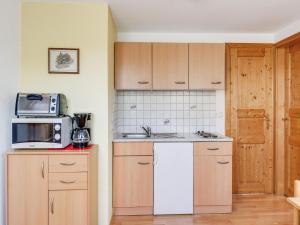 a kitchen with a sink and a microwave at Apartment in Styria near Grebenzen in Ligist