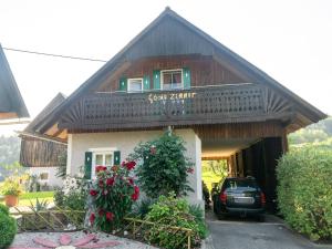 a house with a car parked in front of it at Apartment in Styria near Grebenzen in Ligist