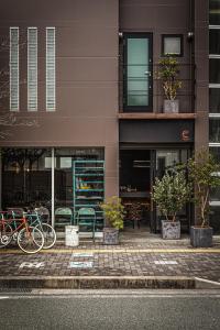 a group of bikes parked in front of a building at The EKAI in Toyohashi