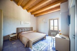 Hotel Casale Milocca客房内的一张或多张床位