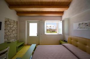 Hotel Casale Milocca客房内的一张或多张床位
