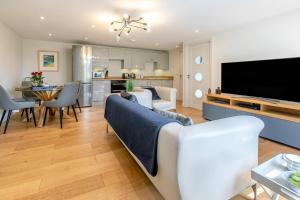 a living room with a couch and a tv at 1 Bed in Lostwithiel oc-n32748 in Lostwithiel