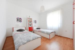 Postel nebo postele na pokoji v ubytování Apartment Becca