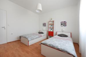 Postel nebo postele na pokoji v ubytování Apartment Becca