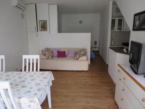 a living room with a couch and a table at Apartment Frano in Drače