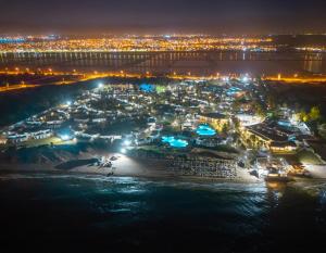 an aerial view of a city at night at One Resort Aqua Park in Monastir