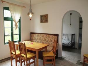 a dining room with a table and chairs and a couch at Gorgeous apartment in Neuburg with terrace in Neuburg-Steinhausen