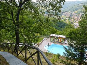a swimming pool with a view of a city at Country Cottage in Marche with Swimming Pool in Apecchio