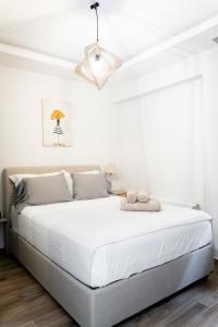 Ένα ή περισσότερα κρεβάτια σε δωμάτιο στο Aristotelous Forum Apartment - Thessaloniki Center