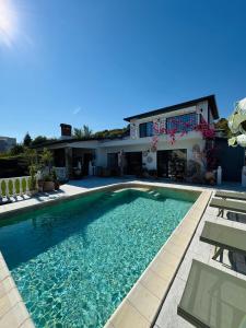a swimming pool in front of a house at Villa Casa Nova - with Heated Pool in Balchik +80 photos