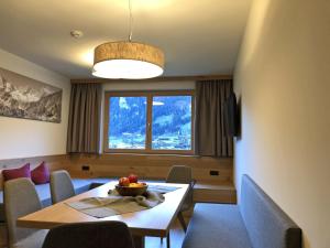 a dining room with a table with a bowl of fruit on it at Farmhouse in Schwendau with Ski Storage in Hippach