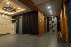 a hallway of an office with a ceiling fan at The solace pahalgam in Pahalgām