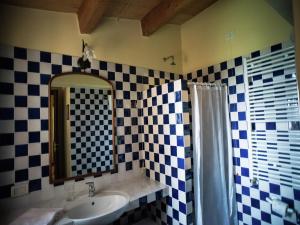 a bathroom with a sink and a mirror at Holiday Home in Paciano with Swimming Pool,Terrace,Billiards in Paciano