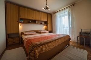 Postel nebo postele na pokoji v ubytování Apartments Tonšić