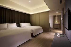 Letto o letti in una camera di 礁溪晶泉丰旅 Wellspring by Silks Jiaoxi