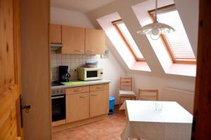 a kitchen with two skylights and a stove top oven at Annabell in Kühlungsborn
