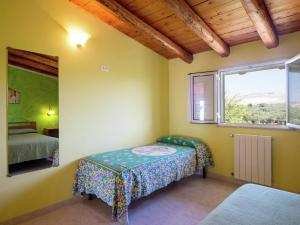 a small room with a table and a window at Holiday Home in Sciacca with Garden, Swimming Pool, Parking in Cartabubbo
