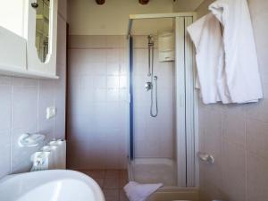 a bathroom with a shower and a toilet and a sink at Holiday Home in Sciacca with Garden, Swimming Pool, Parking in Cartabubbo