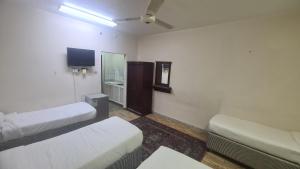 Postel nebo postele na pokoji v ubytování فندق منار الشروق + 2 fotografie