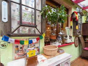 a shop with a window with flags on it at Comfortable Apartment in Wismar Mecklenburg with Fireplace in Wismar